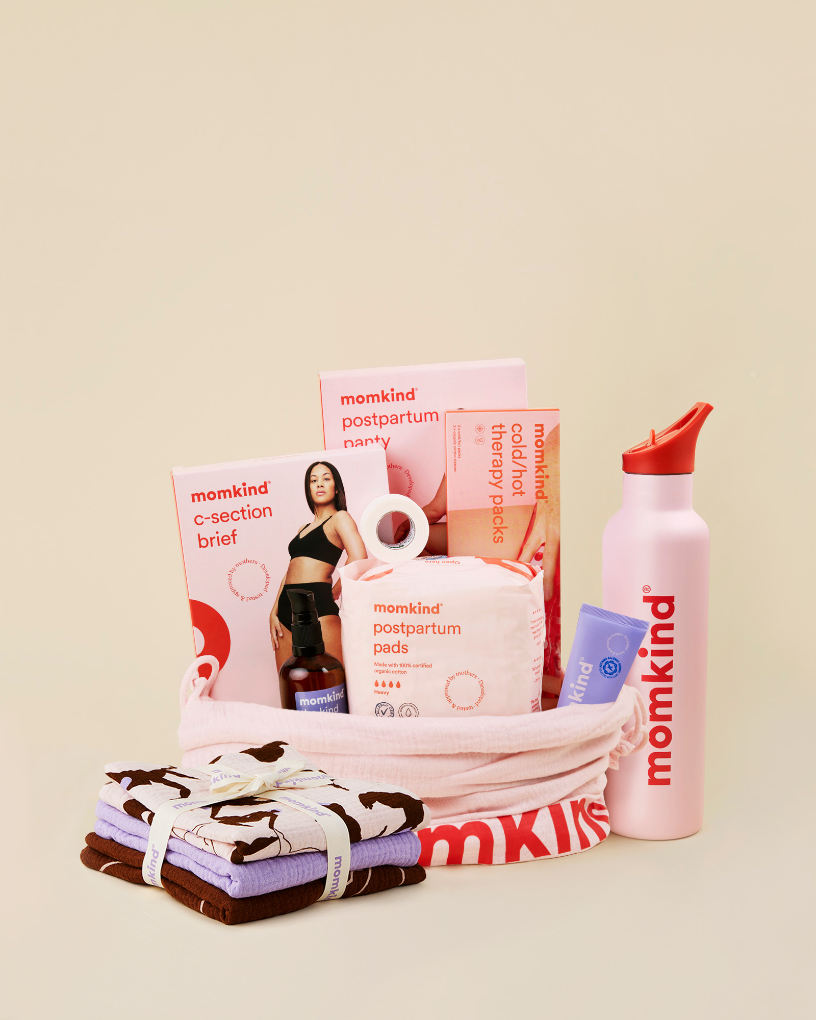 Momkind luksus efterfødselspakke til kejsersnit. Efterfødselsbind, lanolin balm, kejsersnittrusser, efterfødselstrusser, sovemaske, termo drikkedunk, varme/køle pose.